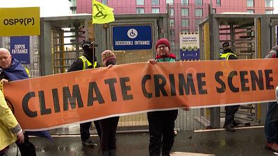 Hundreds protest at COP26 as negotiations draw to a close