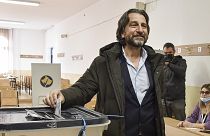 Përparim Rama, centre, candidate for the mayor from Democratic League of Kosovo, (LDK), casts his vote in Pristina, Kosovo, on Sunday, Nov. 14, 2021