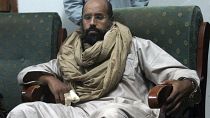 FILE - Seif al-Islam is seen after his capture in the custody of revolutionary fighters in Zintan, Libya, Nov. 19, 2011.
