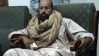 FILE - Seif al-Islam is seen after his capture in the custody of revolutionary fighters in Zintan, Libya, Nov. 19, 2011.