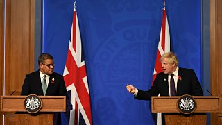 Britain's Prime Minister Boris Johnson, right, and Alok Sharma, President of the Cop26 in London on 14 November 2021.