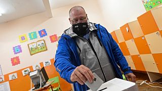 A man casts his vote at a polling station in Bankya, on the outskirts of Sofia, Bulgaria, Sunday, Nov. 14, 2021.