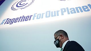 Alok Sharma, president of the COP26 summit, gets up after a stocktaking plenary session in Glasgow on November 13