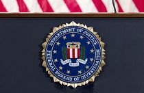 This June 14, 2018 file photo shows an FBI seal on a podium before a news conference at the agency's headquarters in Washington.