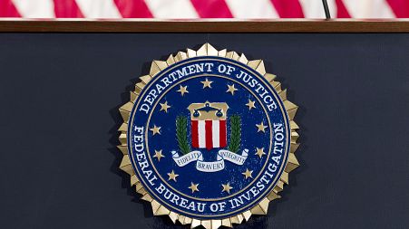 This June 14, 2018 file photo shows an FBI seal on a podium before a news conference at the agency's headquarters in Washington.