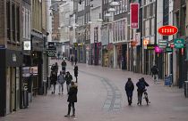 All non-essential stores remain closed and only a few people are seen in the center of Nijmegen, Netherlands, Friday, Jan. 14, 2022