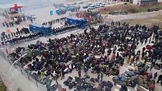 Scores of migrants leave camp for Belarus-Poland border