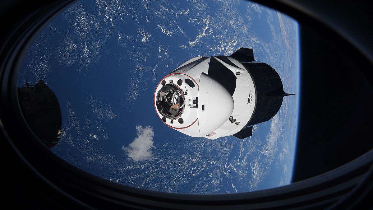 In this April 24, 2021 file photo made available by NASA, the SpaceX Crew Dragon capsule approaches the International Space Station for docking. 