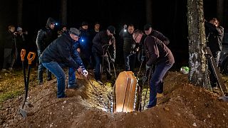 Imam Aleksander Bazarewicz says a prayer at the funeral of 19-year-old Syrian refugee Ahmad who drowned in the border river Bug trying to reach Poland, Bohoniki, Nov 15, 2021.
