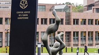 A man walks by the European Court of Justice in Luxembourg, Oct. 5, 2015.