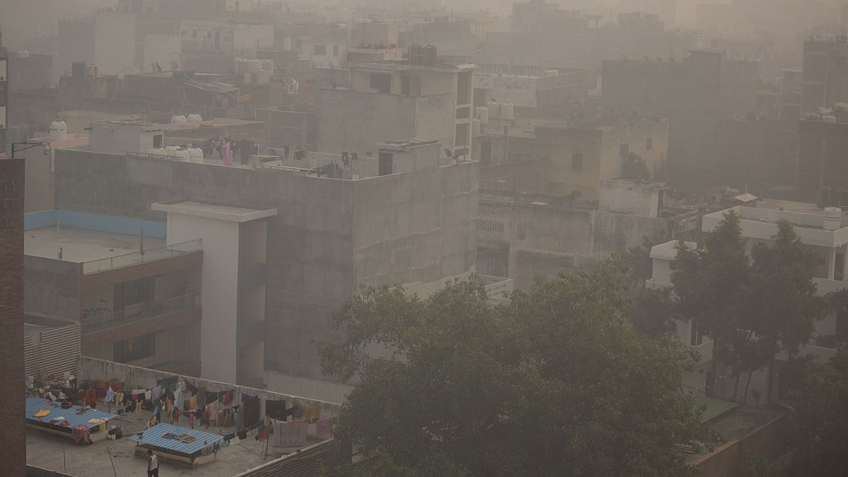 Morning haze and smog envelops the skyline in New Delhi, India, Friday, Nov. 5, 2021.