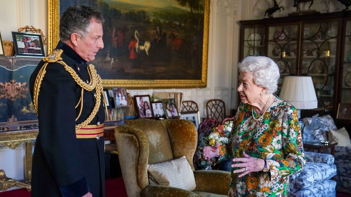 Queen Elizabeth II receives General Sir Nick Carter, Chief of the Defence Staff, left, during an audience in the Oak Room at Windsor Castle, Berkshire, Wednesday Nov. 17, 2021