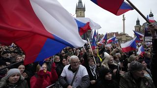 Demonstrators gather to protest against the COVID-19 restriction measures during celebrations of the 32nd anniversary of the Velvet Revolution in Prague, on Nov. 17, 2021. 