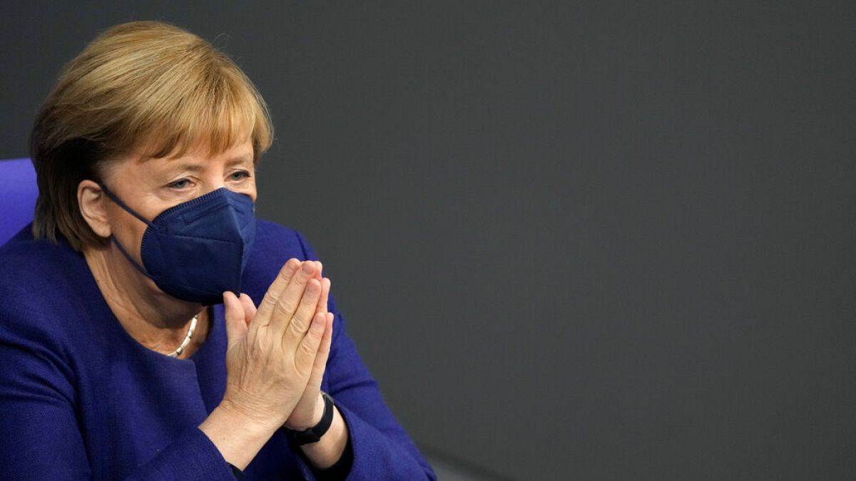 German Chancellor Angela Merkel reacts during a parliament Bundestag session about new measures to battle the coronavirus pandemic, Germany, Nov. 18, 2021. 