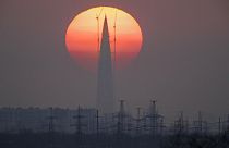 The headquarters of Russian gas company Gazprom is silhouetted against the sunset in St. Petersburg, Russia, on April 15, 2018