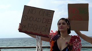 Activists denounce fast fashion in plastic catwalk protest in Tel Aviv
