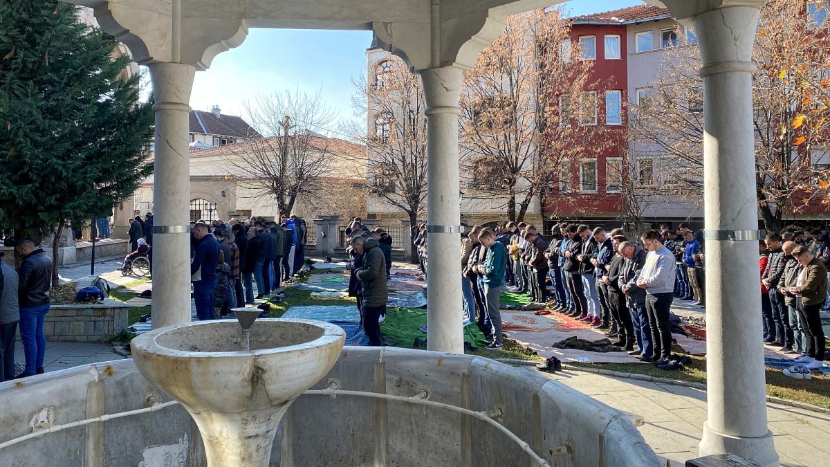 Kosovo Albanian muslim faithfuls attend Friday prayer in the premises of the Grand mosque in Kosovo capital Pristina on Friday, Nov. 19, 2021.