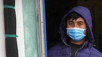 A Vietnamese worker looks on from a barracks described as "prison-like" in Zrenjanin, north of Belgrade, in November