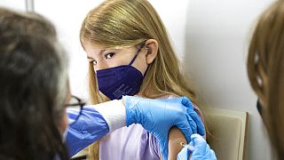 A young patient receives the Pfizer vaccine against COVID-19 in Vienna, Austria, Monday, Nov. 15, 2021.