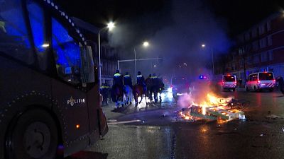 Police arrive at the scene: bikes and pallets set on fire by rioters in the Hague, Netherlands.