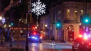 Police canvass the streets in downtown Waukesha, Wisconsin