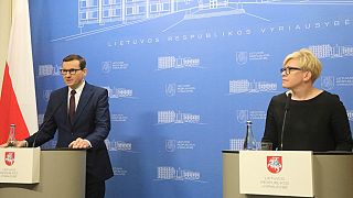 Lithuania's PM Ingrida Simonyte (R) & Poland's PM Mateusz Morawiecki (L) at a press conference on the migrant crisis on the Polish border with Belarus, November 21, 2021.