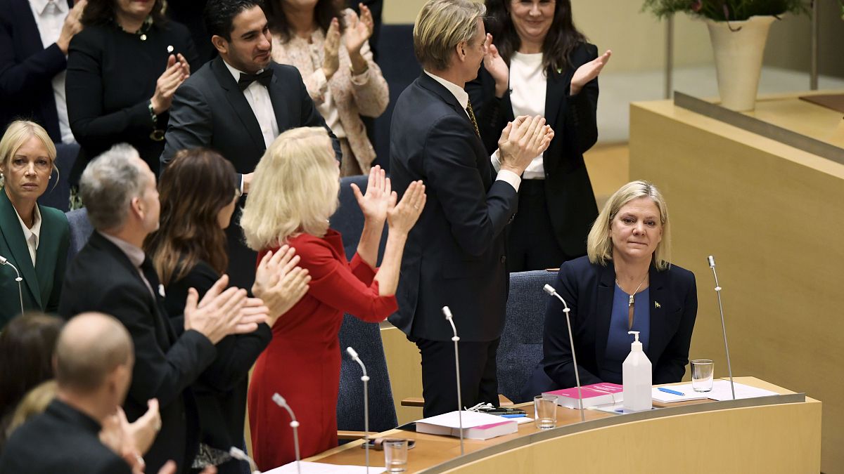 Lawmakers applaud after the vote in which Magdalena Andersson was appointed Sweden's new prime minister
