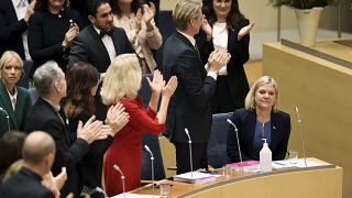 Lawmakers applaud after the vote in which Magdalena Andersson was appointed Sweden's new prime minister
