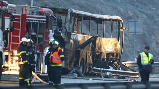 Firefighters and forensic workers inspect the scene of a bus crash in Bulgaria.
