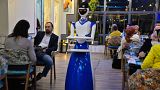 A robot waiter carries empty trays after delivering an order to patrons at the "White Fox" restaurant in the eastern part of Iraq's northern city of Mosul.