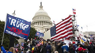 Violent insurrectionists loyal to President Donald Trump stand outside the U.S. Capitol in Washington on Jan. 6, 2021