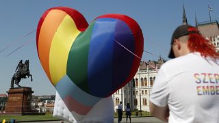 Activists display a large rainbow heart in front of Hungary's parliament building in Budapest in July.