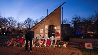 A memorial at Veteran's Park for the victims of Sunday's deadly Christmas parade crash in Waukesha