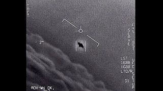 The image from video provided by the Department of Defense labelled Gimbal, from 2015, an unexplained object is seen at center. 