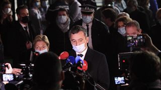 French Interior Minister Gerald Darmanin answers the press in Calais, northern France, Wednesday, Nov. 24, 2021