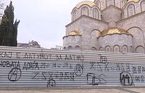A graffiti reading "Where is the date for the date (to start the negotiations)?" in Skopje.