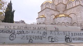 A graffiti reading "Where is the date for the date (to start the negotiations)?" in Skopje.