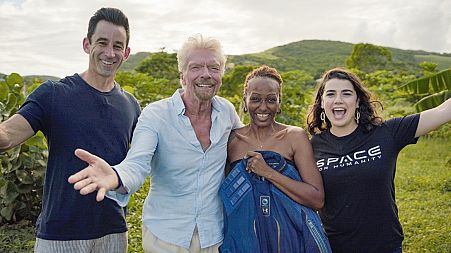 In this Handout photo on November 24, 2021, Omaze CEO and co-founder Matt Pohlson, Sir Richard Branson, Keisha S., and Space For Humanity executive director Rachel Lyons.