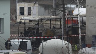 The burned out wreckage of the bus stored in a investigation service warehouse in the town of Pernik.