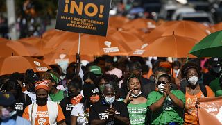 Demonstrators mark the International Day for the Elimination of Violence Against Women, in Santo Domingo, Dominican Republic, Thursday, Nov. 25, 2021.