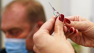 A Hungarian nurse prepares a Chinese made Sinopharm COVID-19 vaccine in Budapest, Hungary, on Wednesday Feb. 24, 2021.