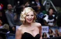 Kim Cattrall poses for photographers at the British premiere of "Sex and the City 2" in London, 2010.