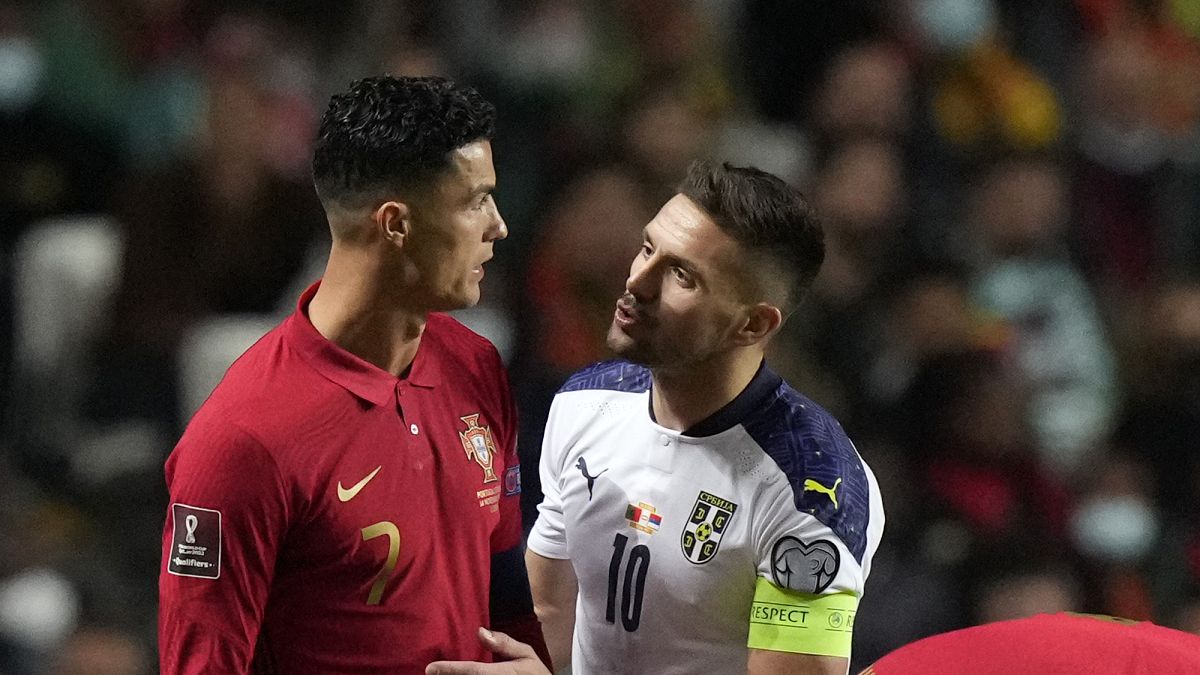 Portugal's Cristiano Ronaldo, left, with Serbia's Dusan Tadic during the World Cup 2022 group A qualifying football match in Lisbon, Nov 14, 2021.