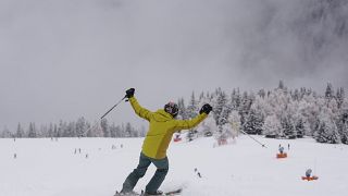 A tourist gestures while skiing, at Plan de Corones ski area, Italy South Tyrol, Nov. 27, 2021. 