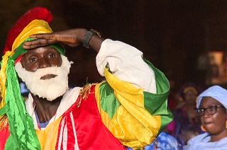 A men dance during the parade at the Dakar carnival.