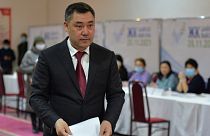 Kyrgyzstan's President Sadyr Zhaparov prepares to cast his ballot at a polling station during the parliamentary elections in Bishkek, Kyrgyzstan, Sunday, Nov. 28, 2021.