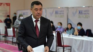 Kyrgyzstan's President Sadyr Zhaparov prepares to cast his ballot at a polling station during the parliamentary elections in Bishkek, Kyrgyzstan, Sunday, Nov. 28, 2021.