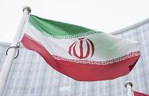 The flag of Iran waves in front of the the International Center building with the headquarters of the International Atomic Energy Agency, IAEA, in Vienna on May 24, 2021.