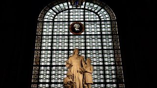 Statues representing Saint Jean Baptiste de La Salle are displayed in a Catholic Church in central Paris.