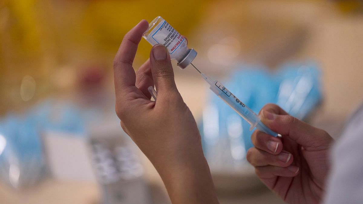 A syringe is loaded with the Moderna COVID-19 vaccine